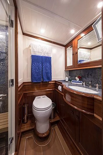 a bathroom with a toilet and sink aboard VIJONARA Yacht for Sale