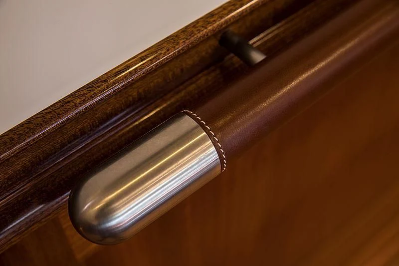 a metal object on a wooden surface aboard VIJONARA Yacht for Sale