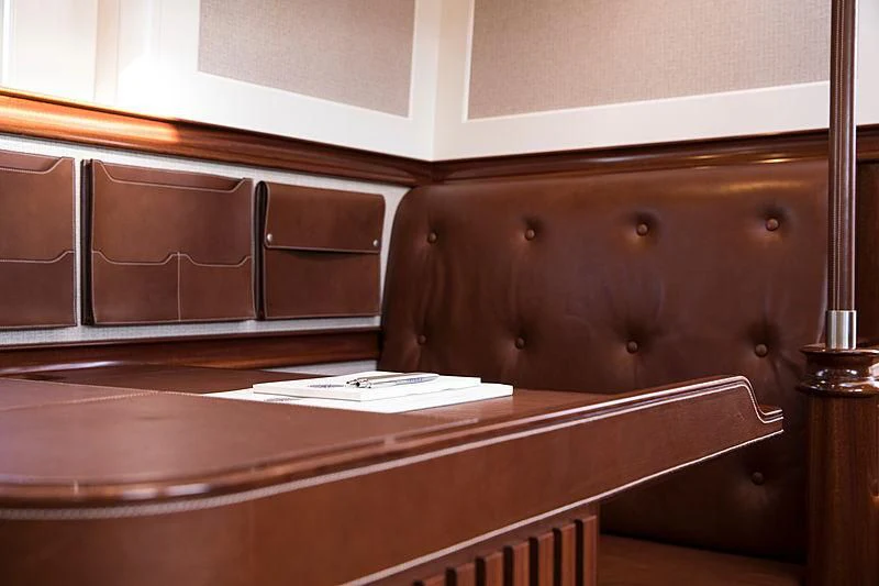 a wooden cabinet with drawers aboard VIJONARA Yacht for Sale