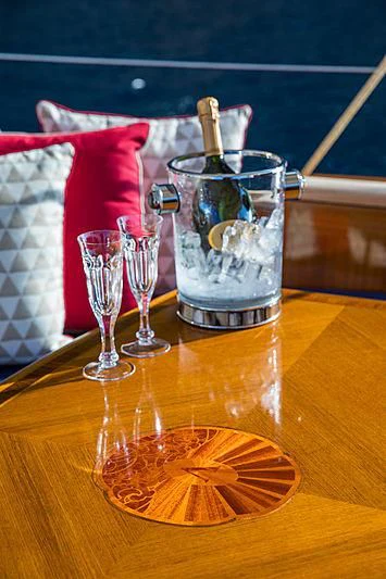 a glass with a drink in it and a straw in it aboard VIJONARA Yacht for Sale