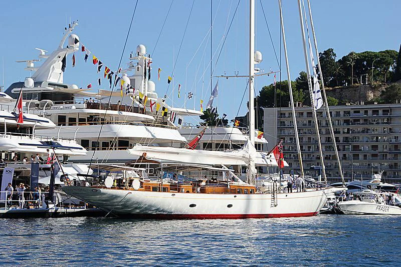 a large white boat in a harbor aboard VIJONARA Yacht for Sale