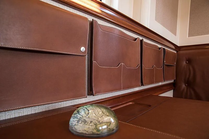 a brown leather couch aboard VIJONARA Yacht for Sale