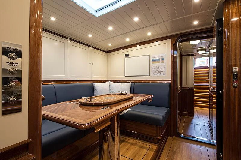 a living room with a couch and a table aboard VIJONARA Yacht for Sale
