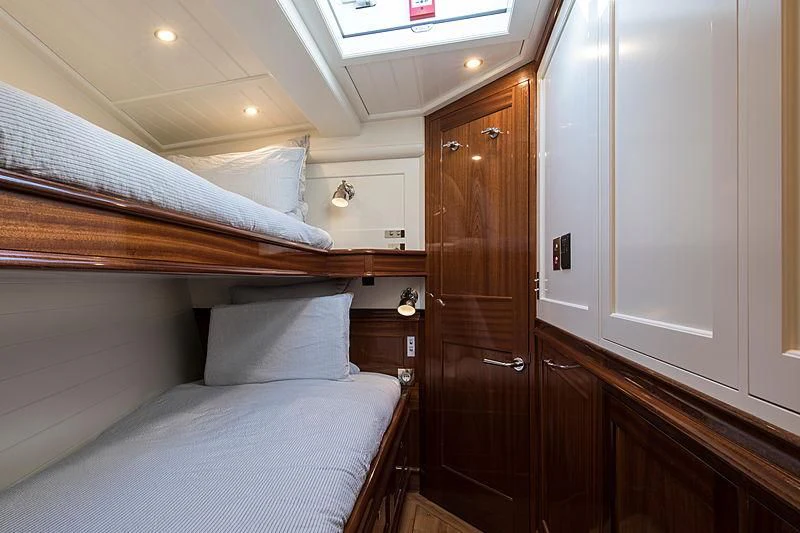 a room with a bed and a closet aboard VIJONARA Yacht for Sale