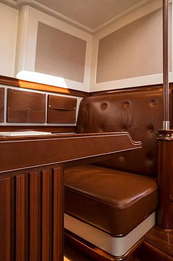 a wooden cabinet with a light on it aboard VIJONARA Yacht for Sale