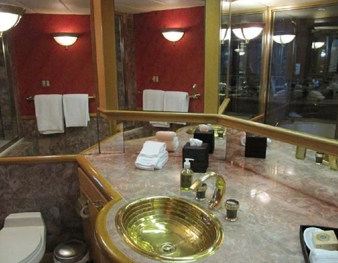 a bathroom with red walls aboard LARA'S THEME Yacht for Sale