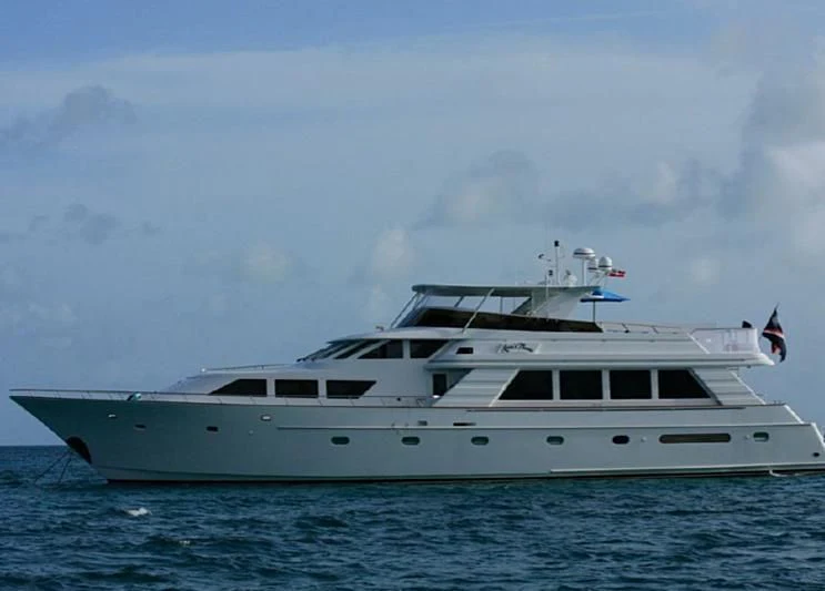 a white yacht in the water aboard LARA'S THEME Yacht for Sale