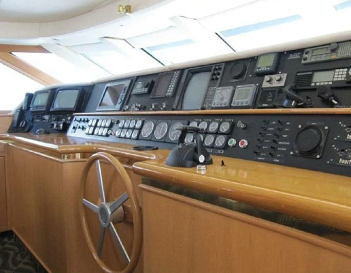 a wooden panel with a panel and buttons aboard LARA'S THEME Yacht for Sale