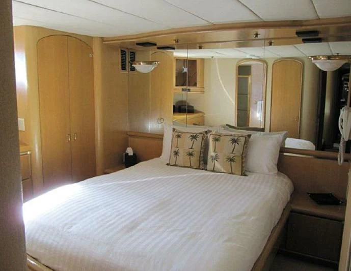 a bed in a room aboard LARA'S THEME Yacht for Sale