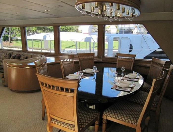a dining table set for a meal aboard LARA'S THEME Yacht for Sale