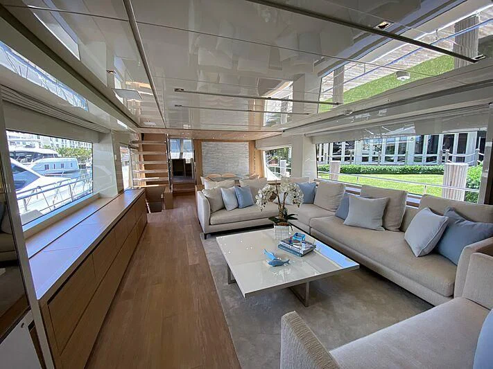 a living room with a large window aboard EASIEST CHILD Yacht for Sale