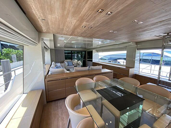 a room with a table and chairs aboard EASIEST CHILD Yacht for Sale
