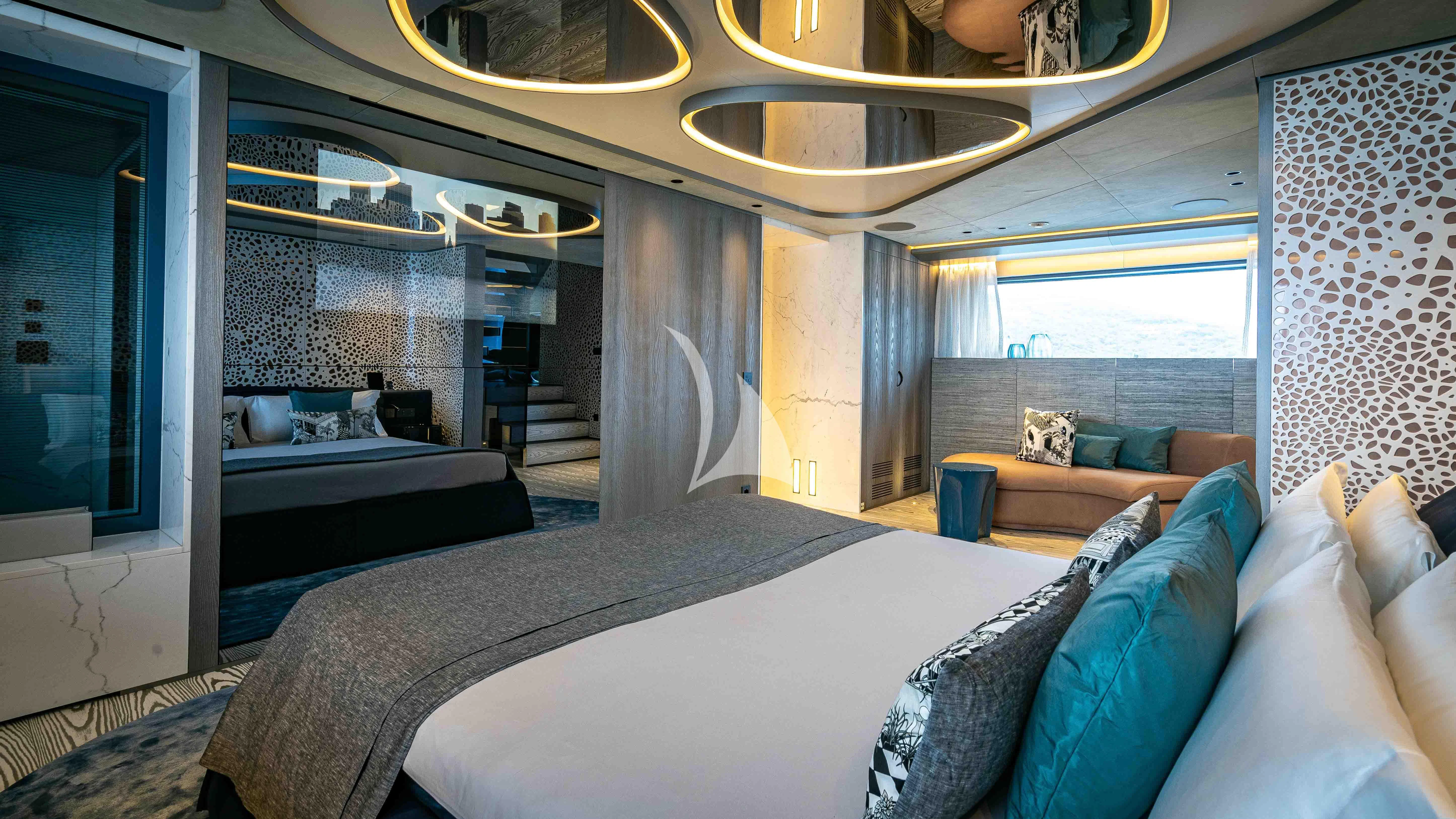 a room with a bed and a couch aboard PANDION PEARL Yacht for Charter