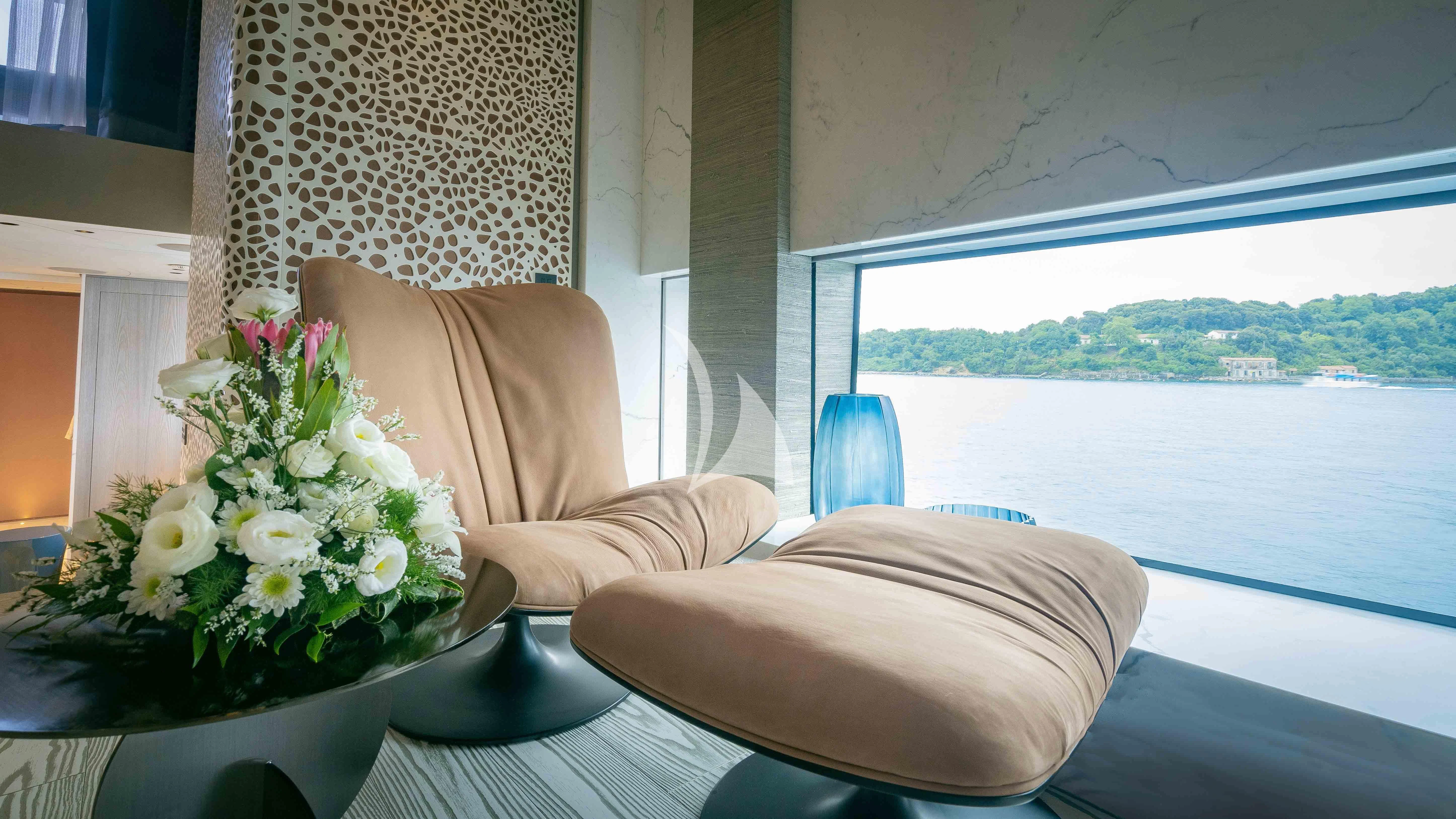 a vase of flowers on a table aboard PANDION PEARL Yacht for Charter