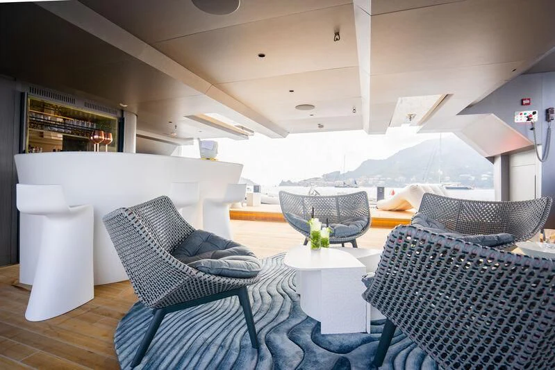 a living room with a couch and a table aboard PANDION PEARL Yacht for Charter