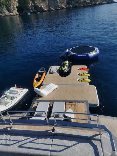 a boat with a motor boat on it aboard PANDION PEARL Yacht for Charter