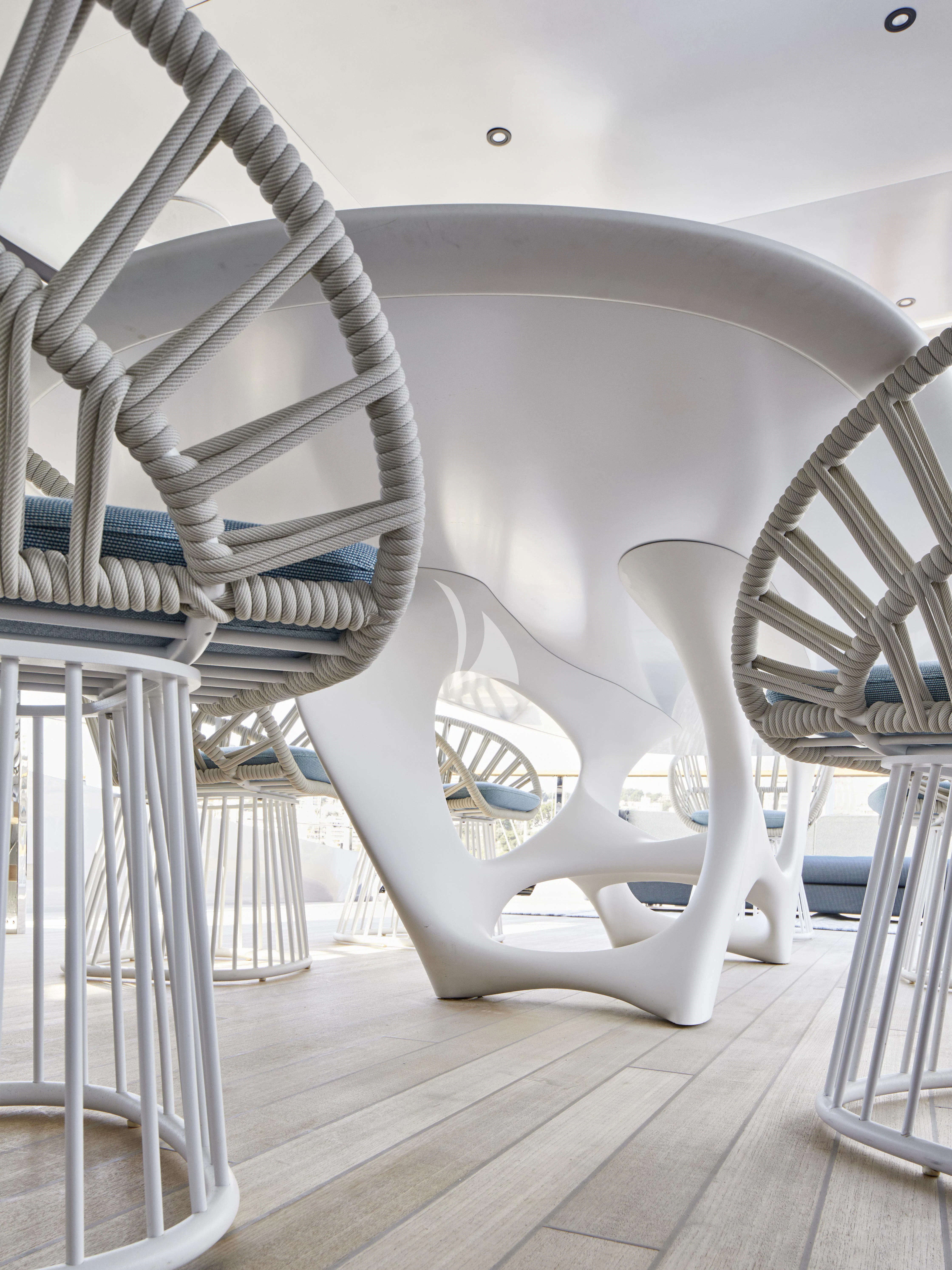 a white spiral staircase aboard PANDION PEARL Yacht for Charter