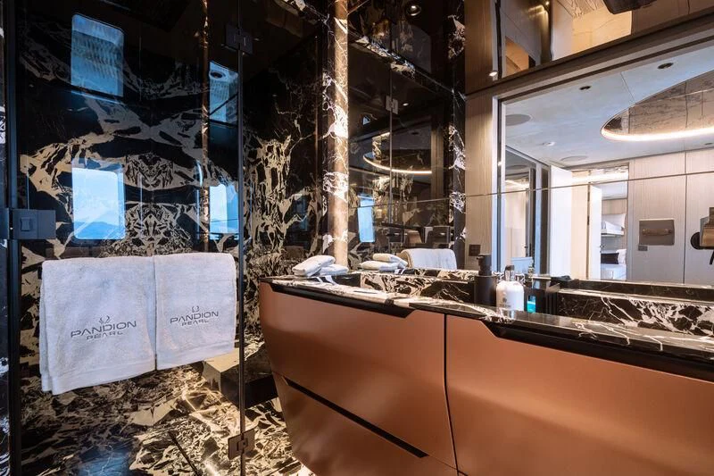 a room with a counter and a sink in it aboard PANDION PEARL Yacht for Charter