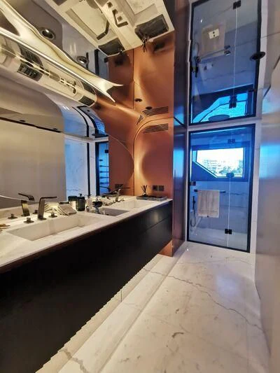 a bathroom with a sink and a mirror aboard PANDION PEARL Yacht for Charter