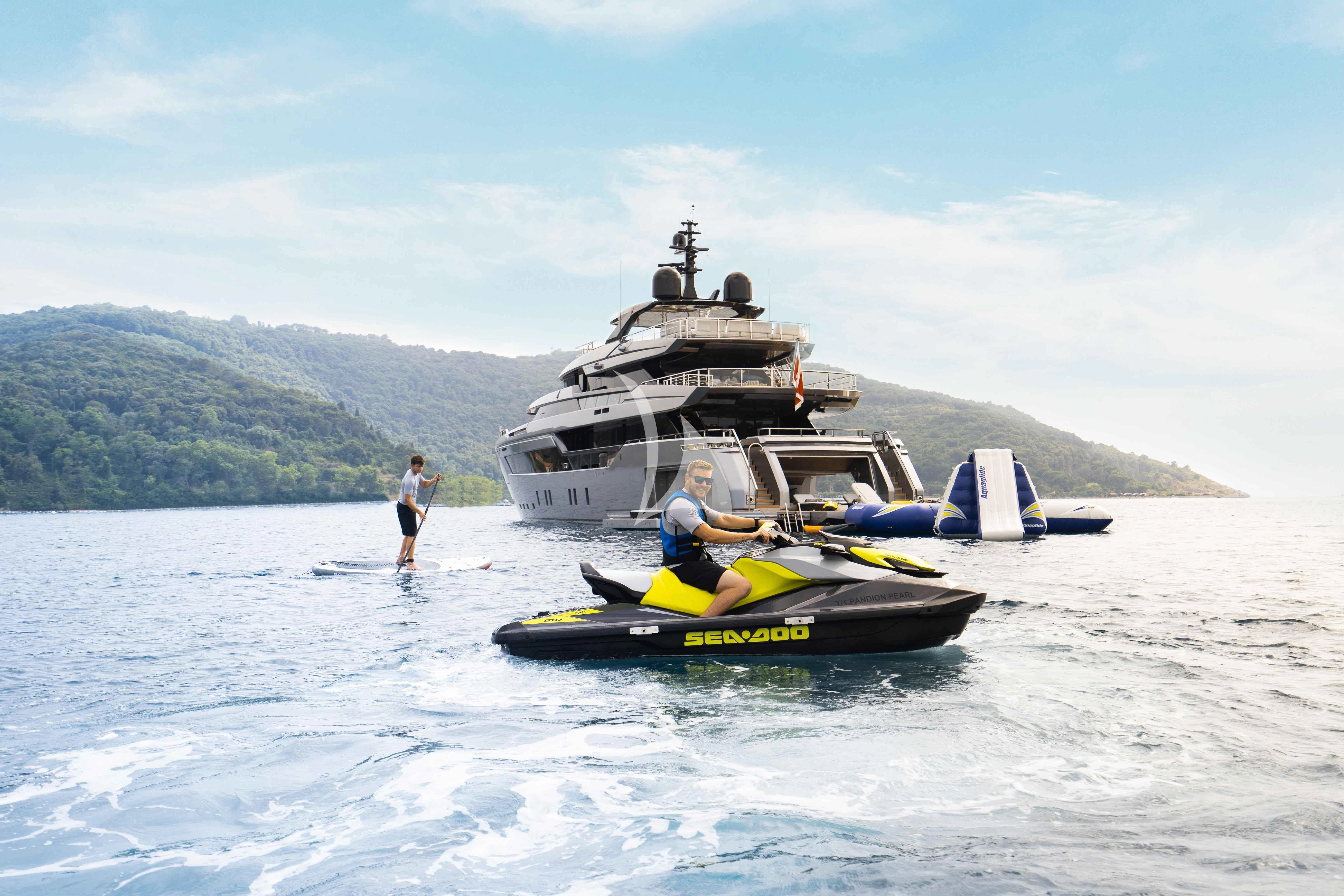 a boat with people on it aboard PANDION PEARL Yacht for Charter