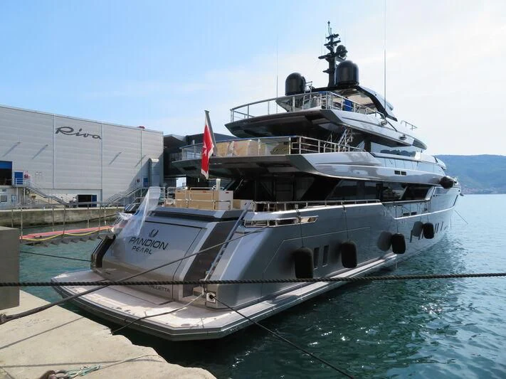 a large ship docked aboard PANDION PEARL Yacht for Charter