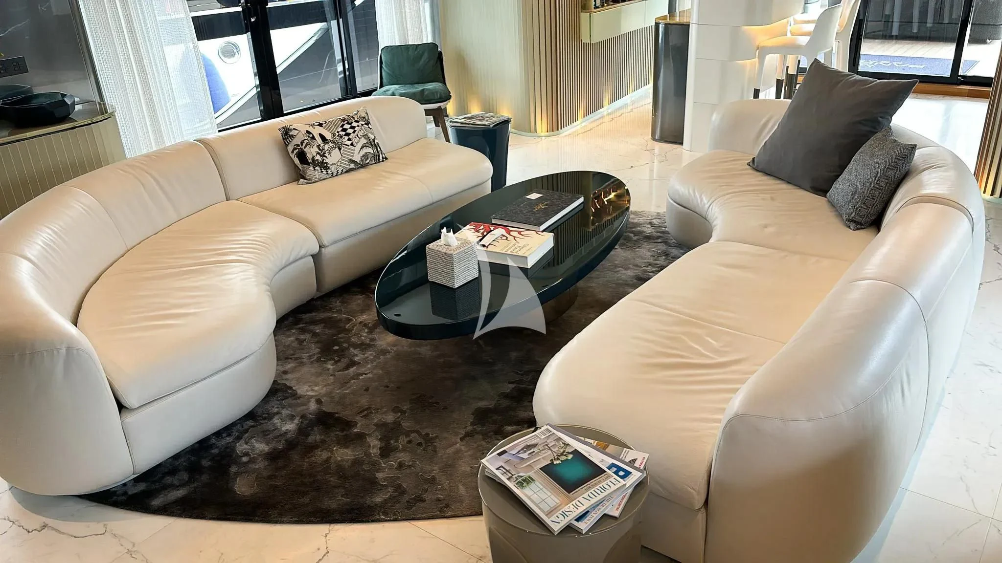 a living room with a couch and a coffee table aboard PANDION PEARL Yacht for Charter