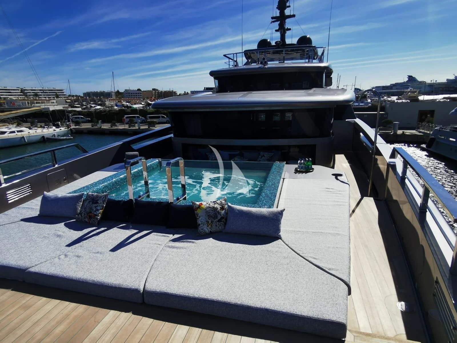 a boat docked at a pier aboard PANDION PEARL Yacht for Charter