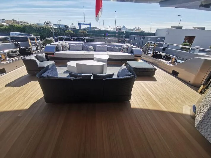 a deck with a large group of boats on it aboard PANDION PEARL Yacht for Charter