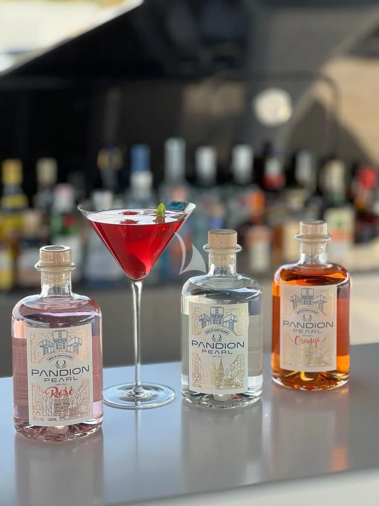 a group of bottles and glasses aboard PANDION PEARL Yacht for Charter