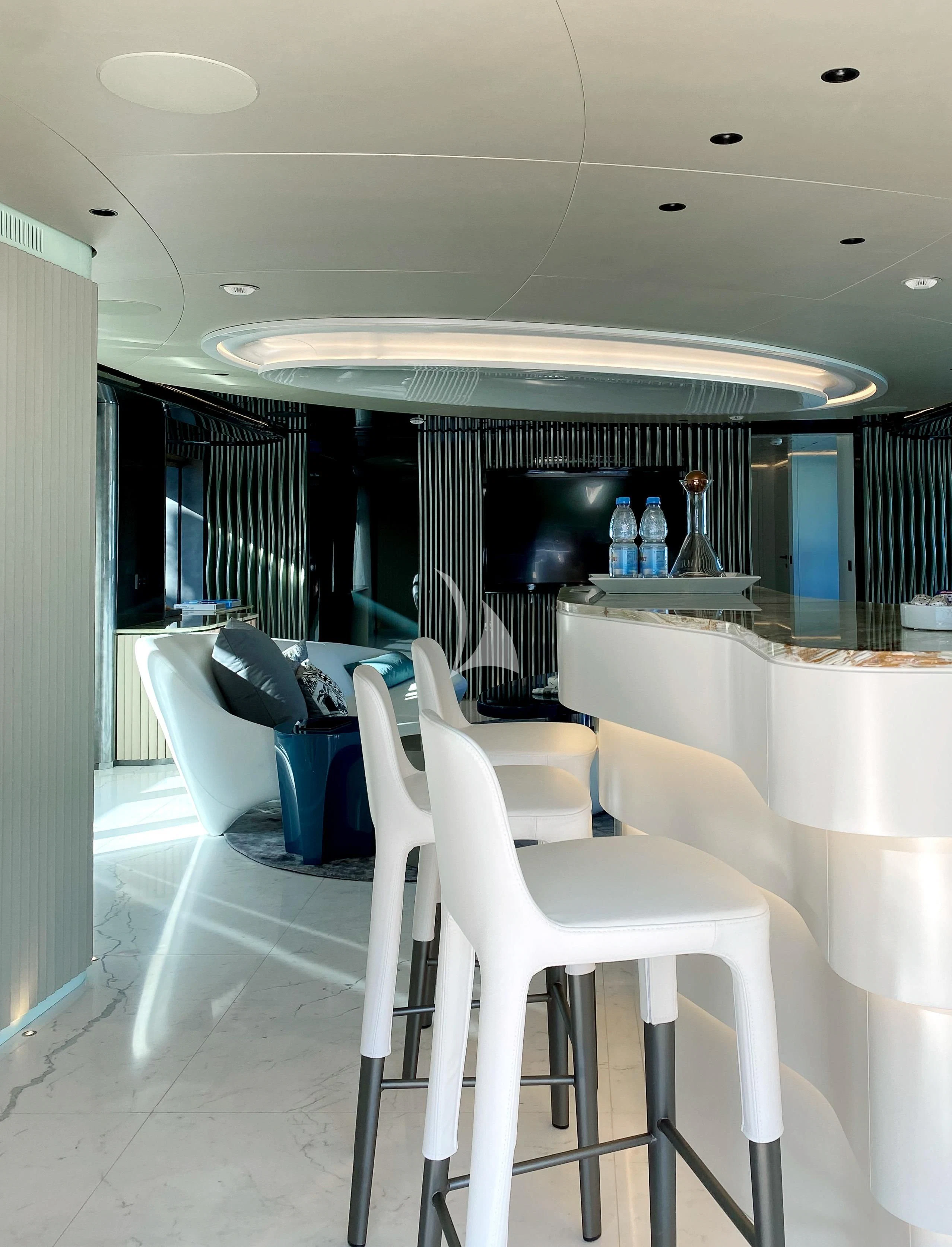 a room with a table and chairs aboard PANDION PEARL Yacht for Charter