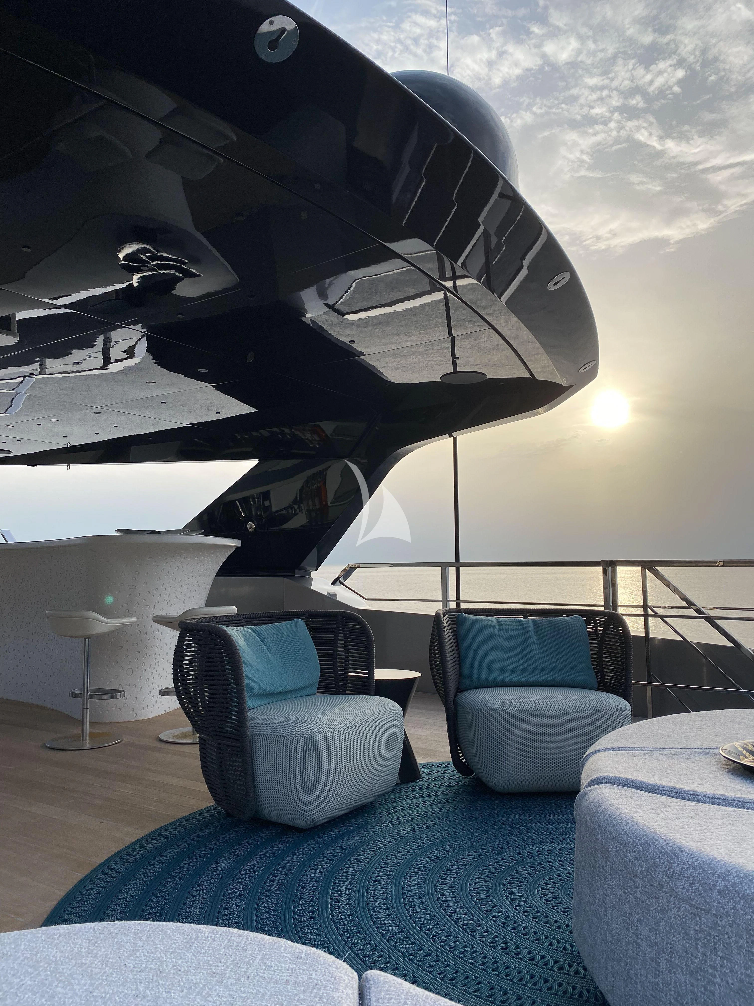 a room with chairs and a table aboard PANDION PEARL Yacht for Charter