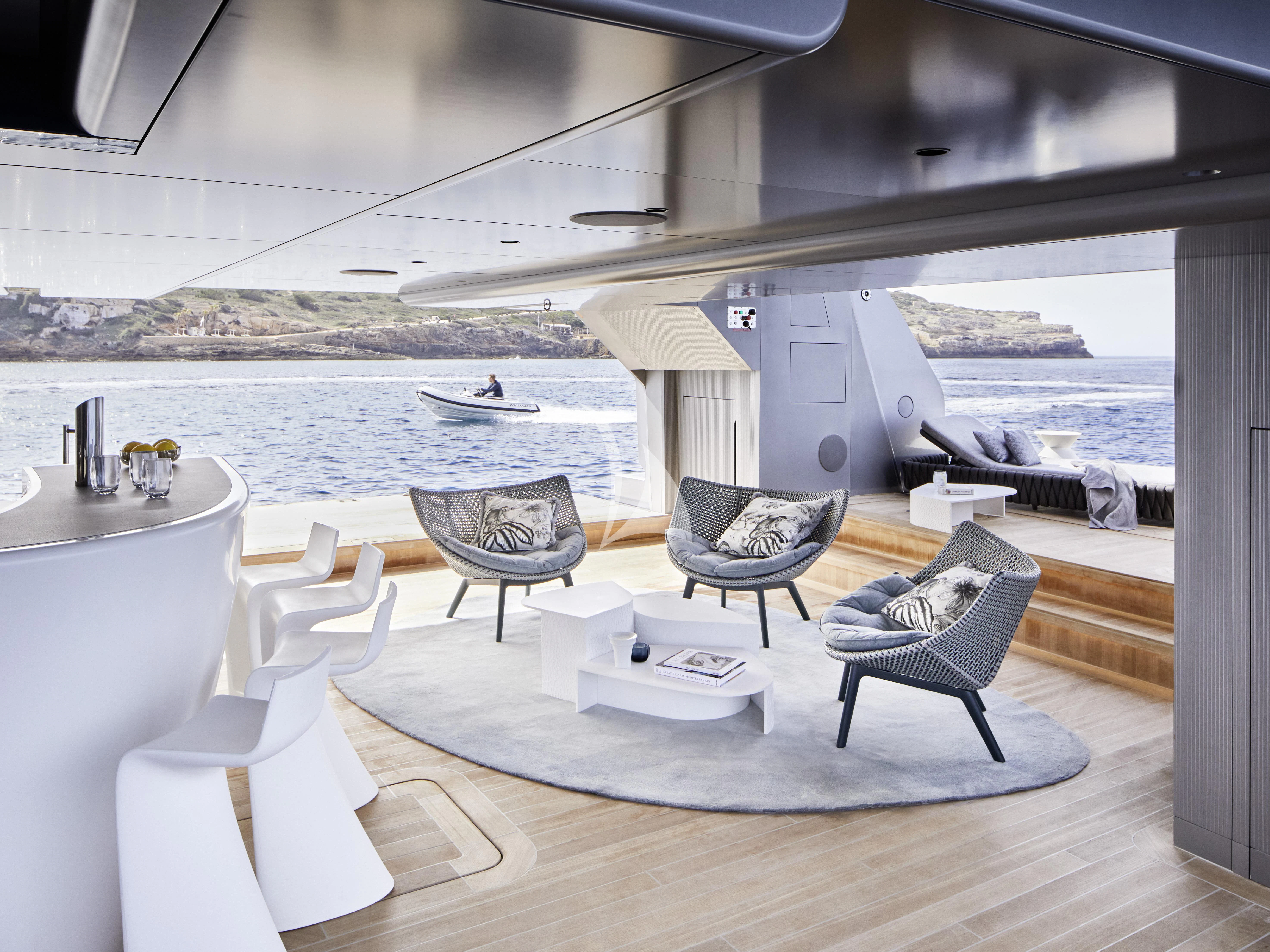 a room with a table and chairs aboard PANDION PEARL Yacht for Charter