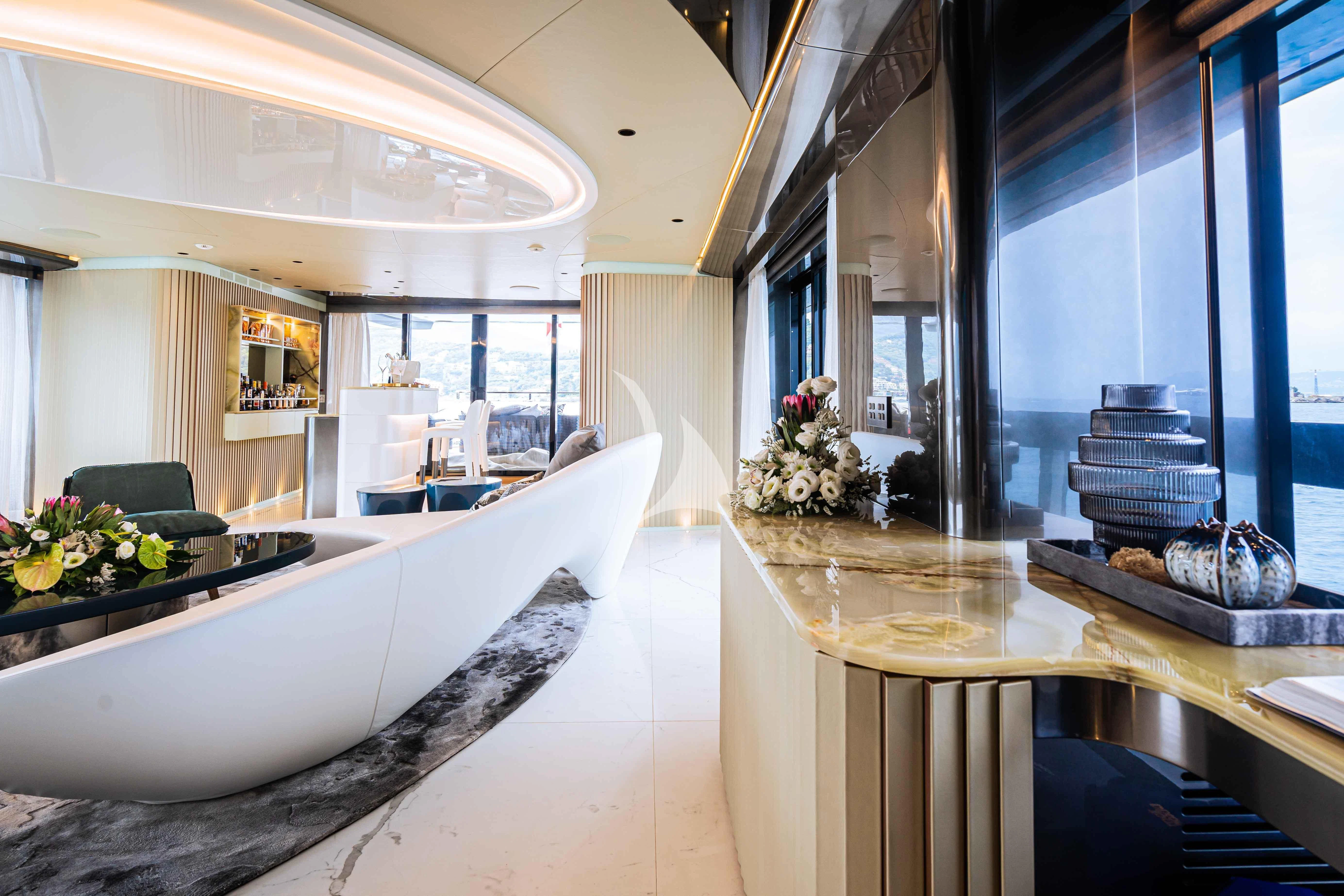 a room with a table and chairs aboard PANDION PEARL Yacht for Charter