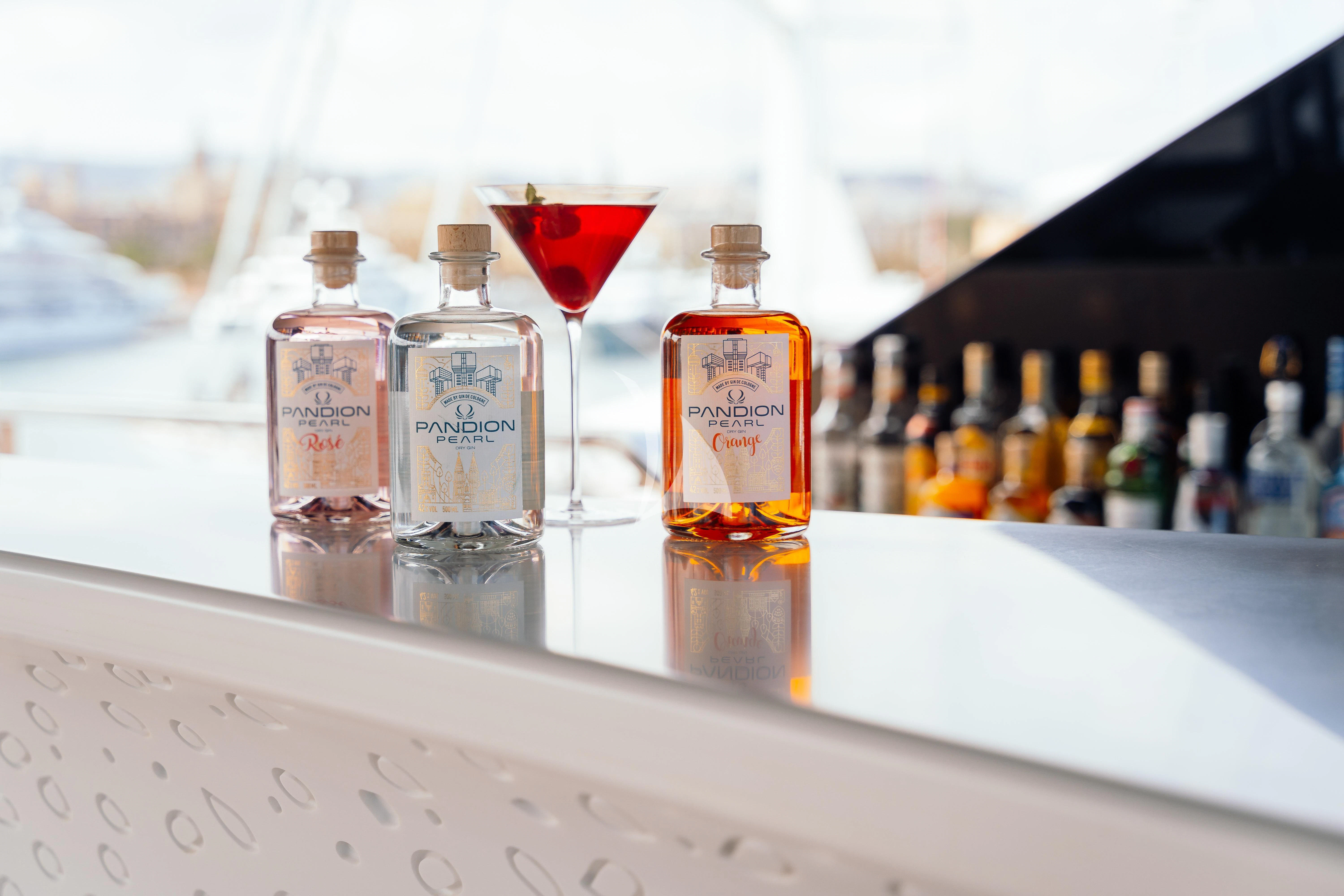 a group of bottles and glasses aboard PANDION PEARL Yacht for Charter