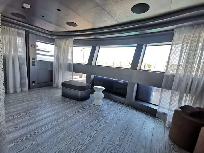 a room with a large window aboard PANDION PEARL Yacht for Charter