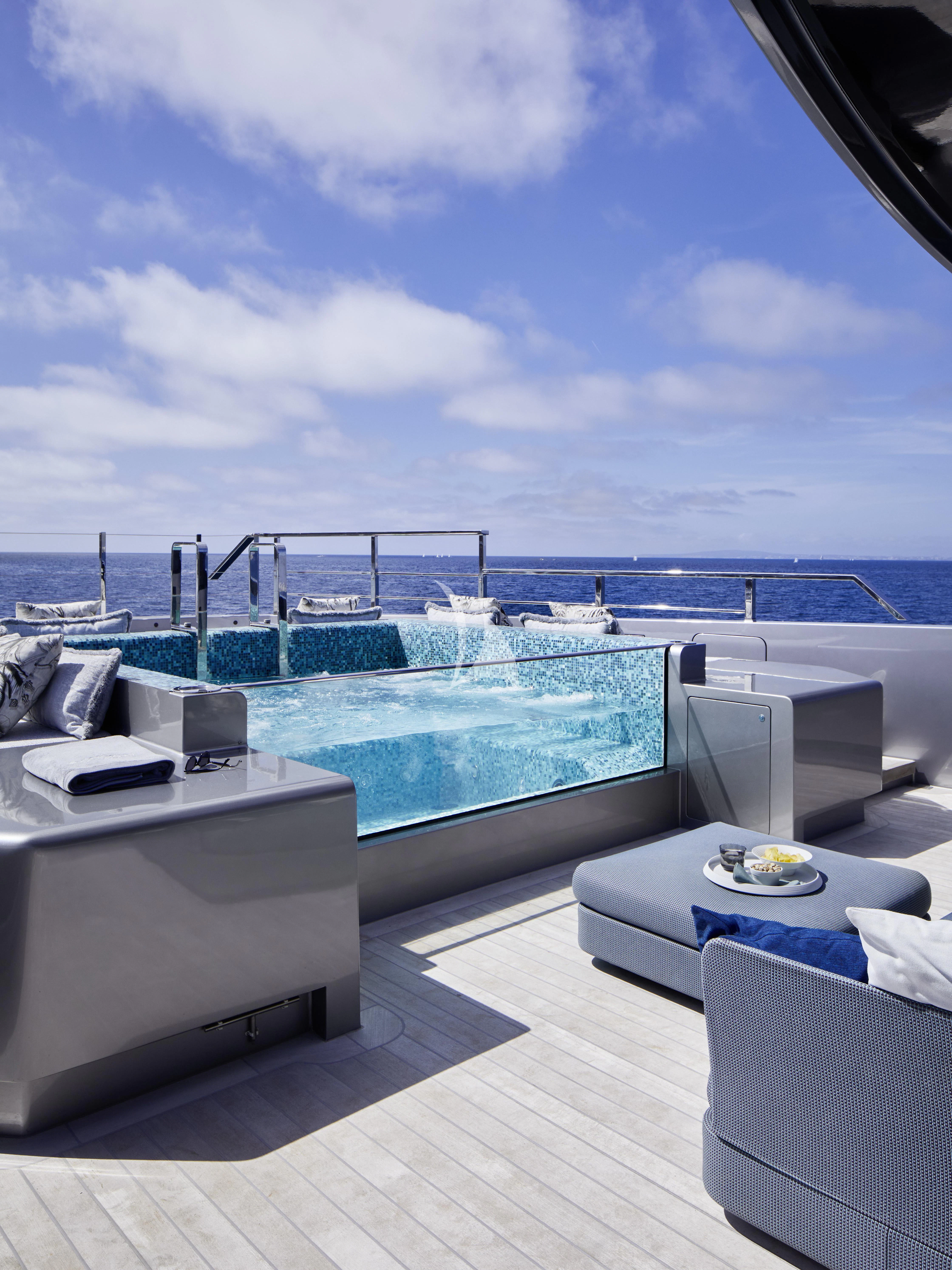 a balcony overlooking a large body of water aboard PANDION PEARL Yacht for Charter