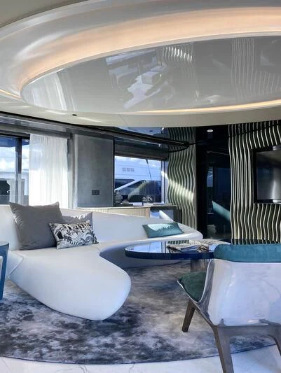 a living room with a large window aboard PANDION PEARL Yacht for Charter