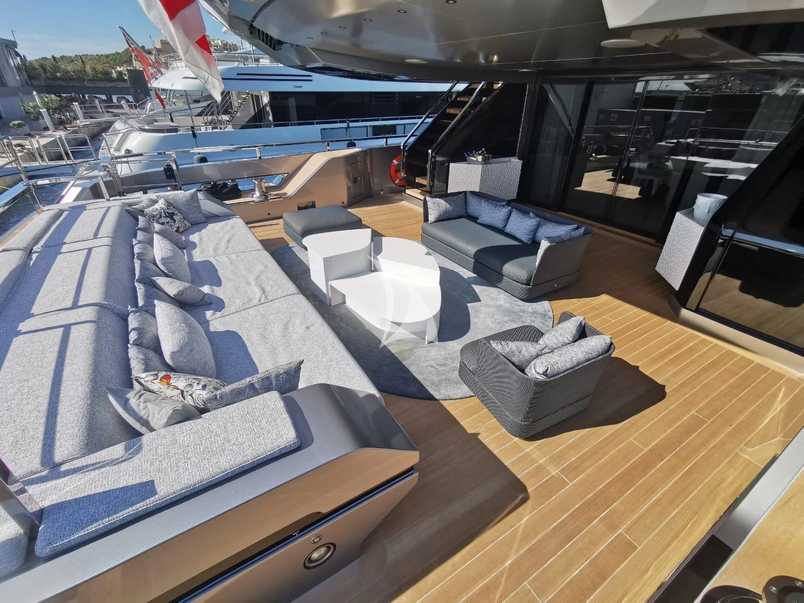 a large room with a deck and a pool aboard PANDION PEARL Yacht for Charter