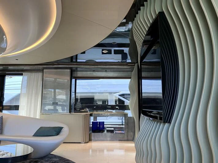 a room with a large window and a tub aboard PANDION PEARL Yacht for Charter