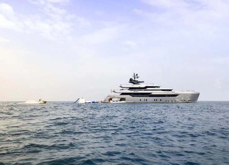 a large white ship in the water aboard PANDION PEARL Yacht for Charter