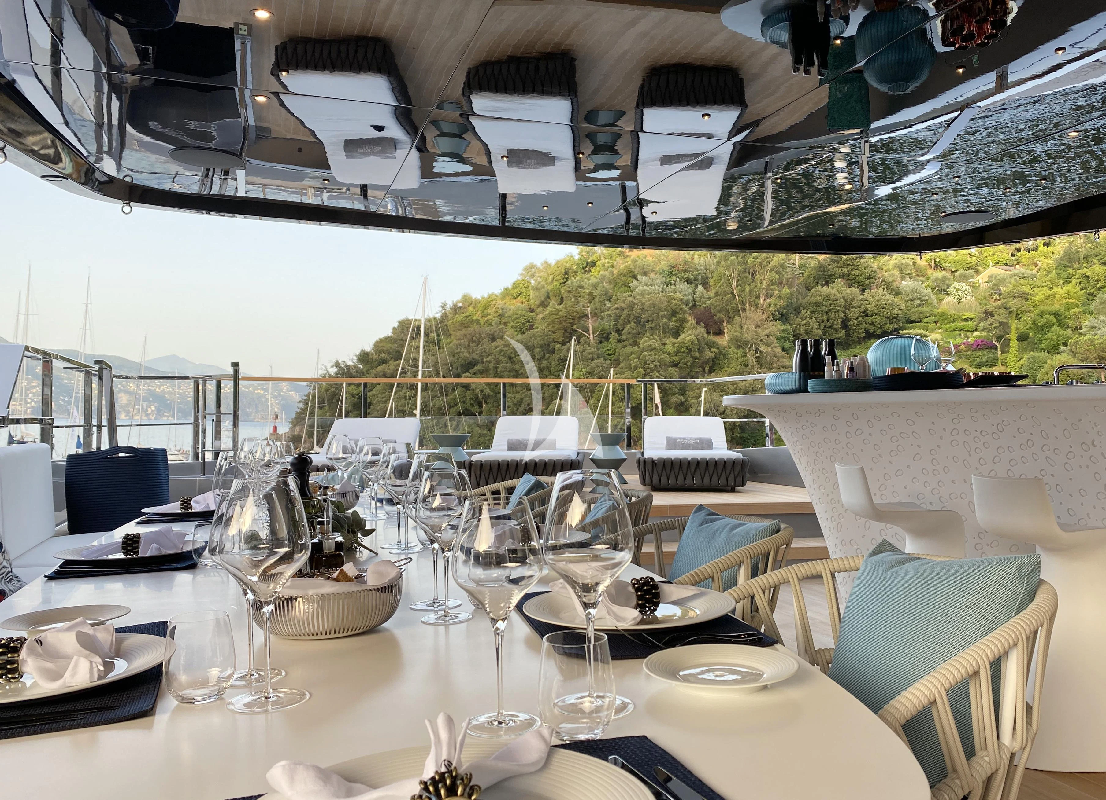 a table set for a dinner aboard PANDION PEARL Yacht for Charter