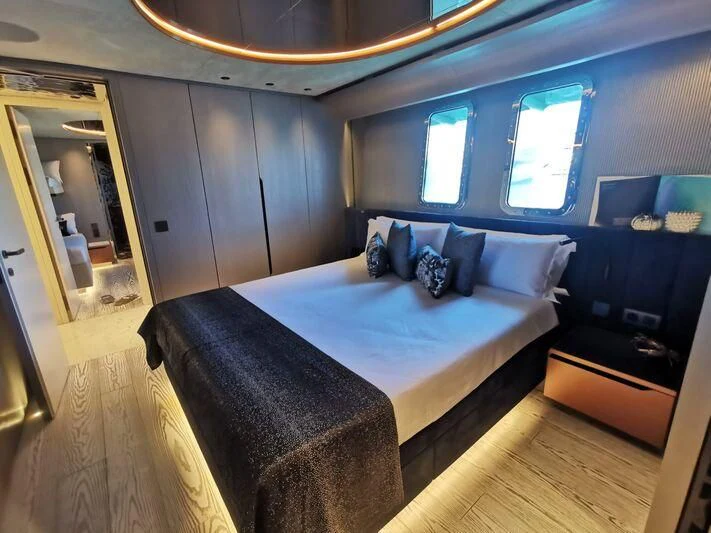a bed in a room aboard PANDION PEARL Yacht for Charter