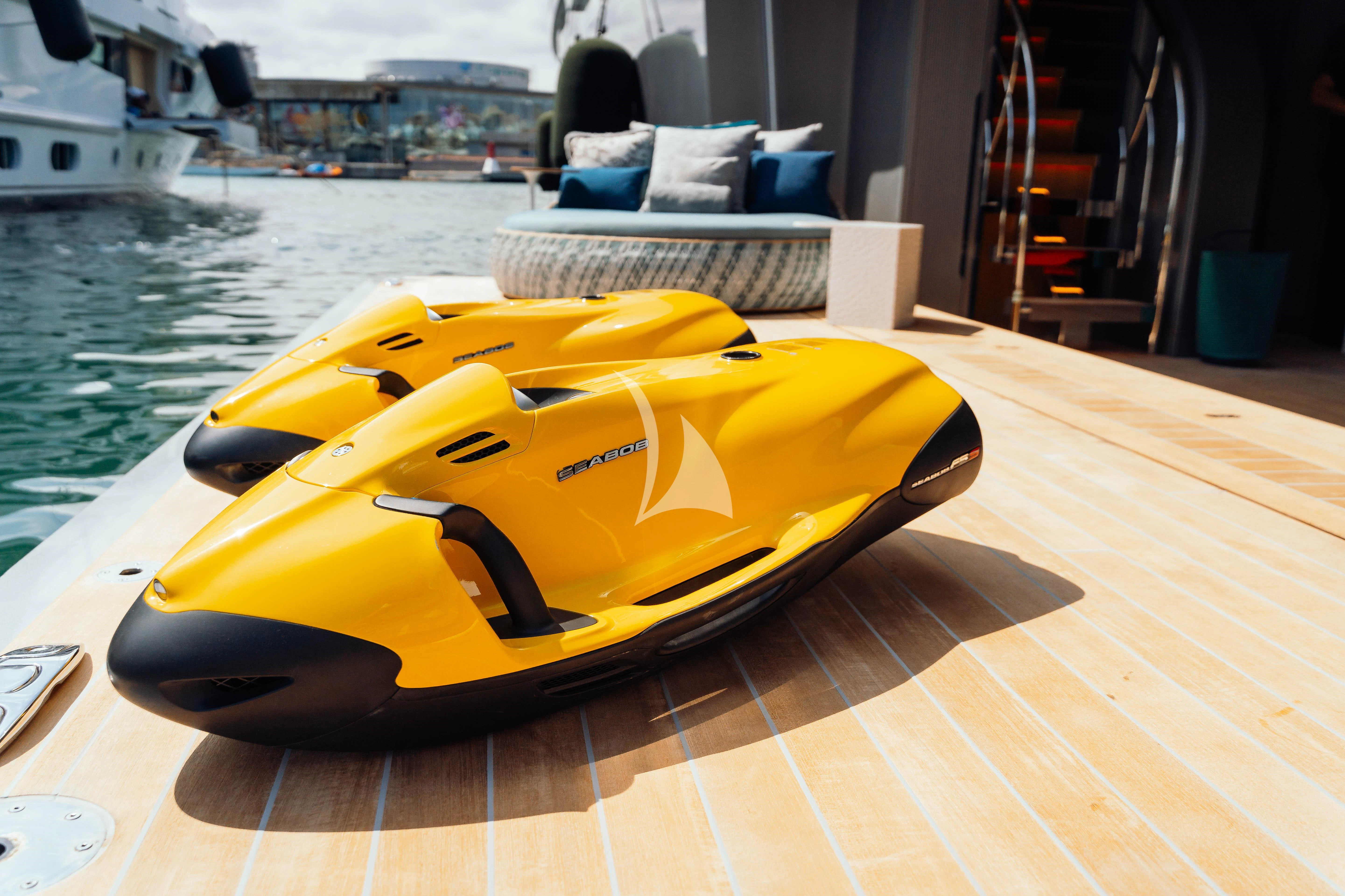 a yellow kayak on a deck aboard PANDION PEARL Yacht for Charter