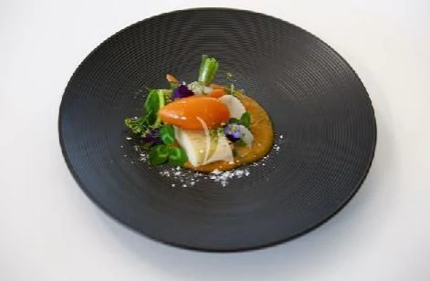 a plate of food aboard PANDION PEARL Yacht for Charter