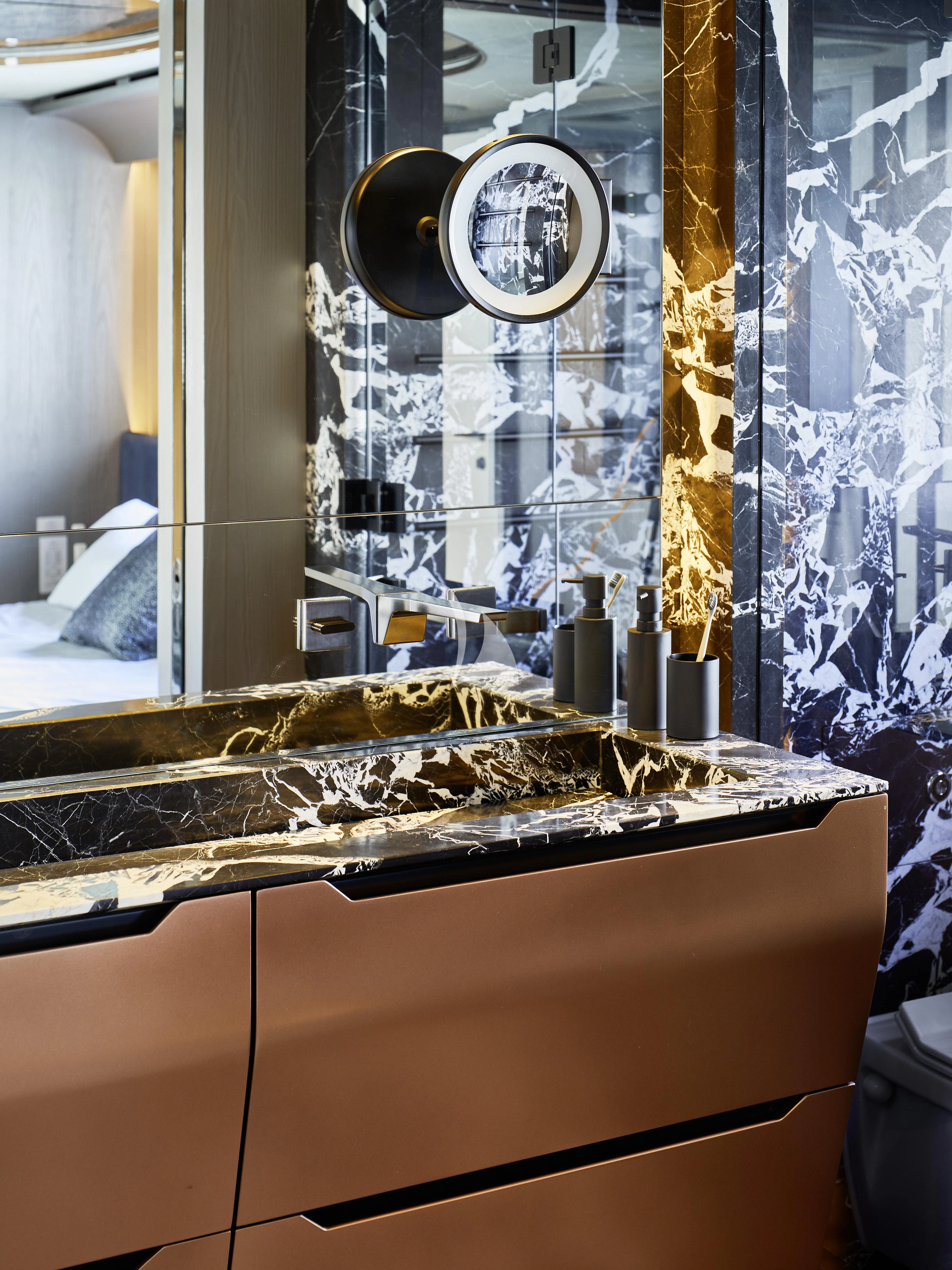 a bathroom with a large mirror aboard PANDION PEARL Yacht for Charter