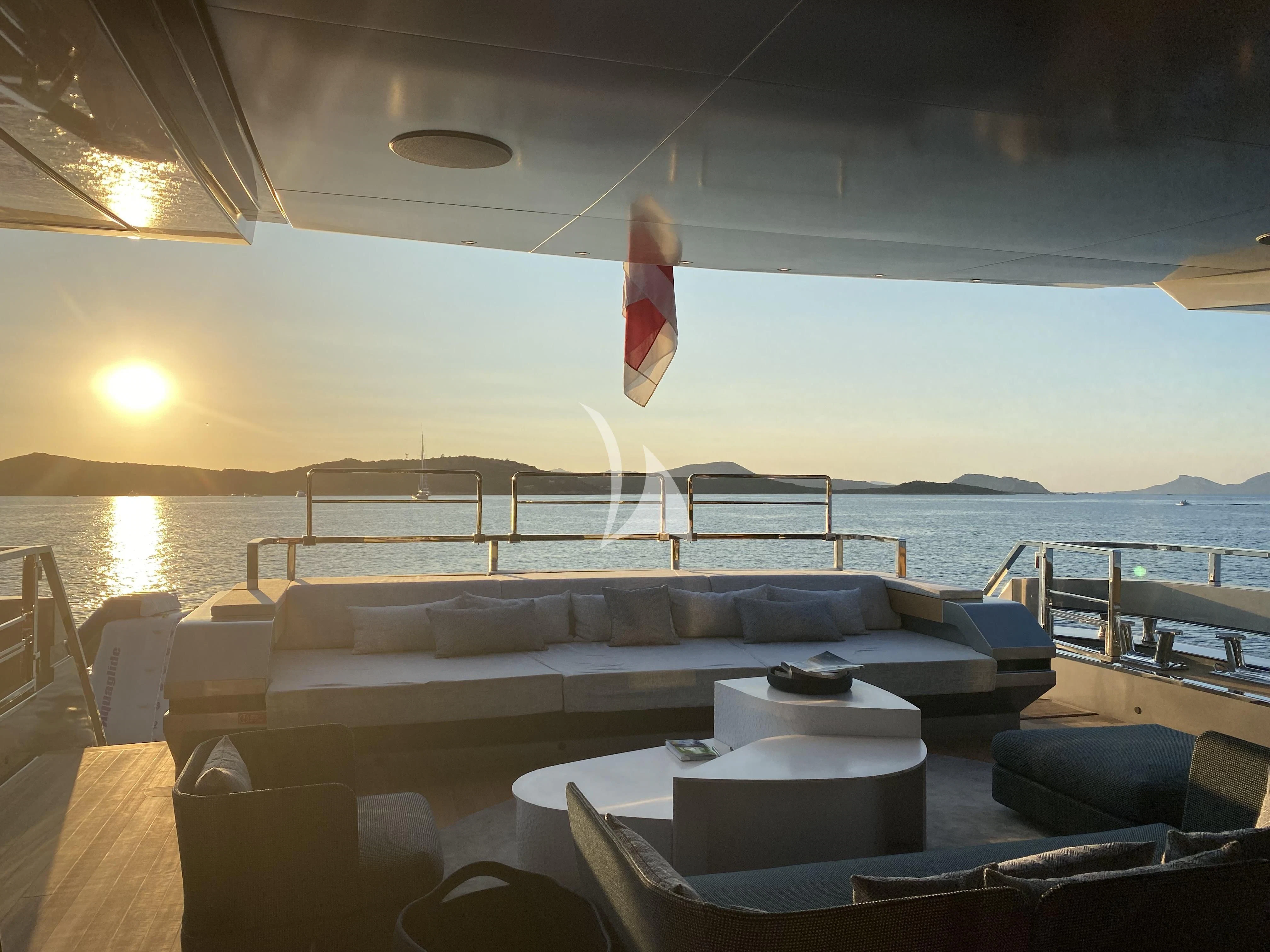 a room with a couch and a table and chairs aboard PANDION PEARL Yacht for Charter