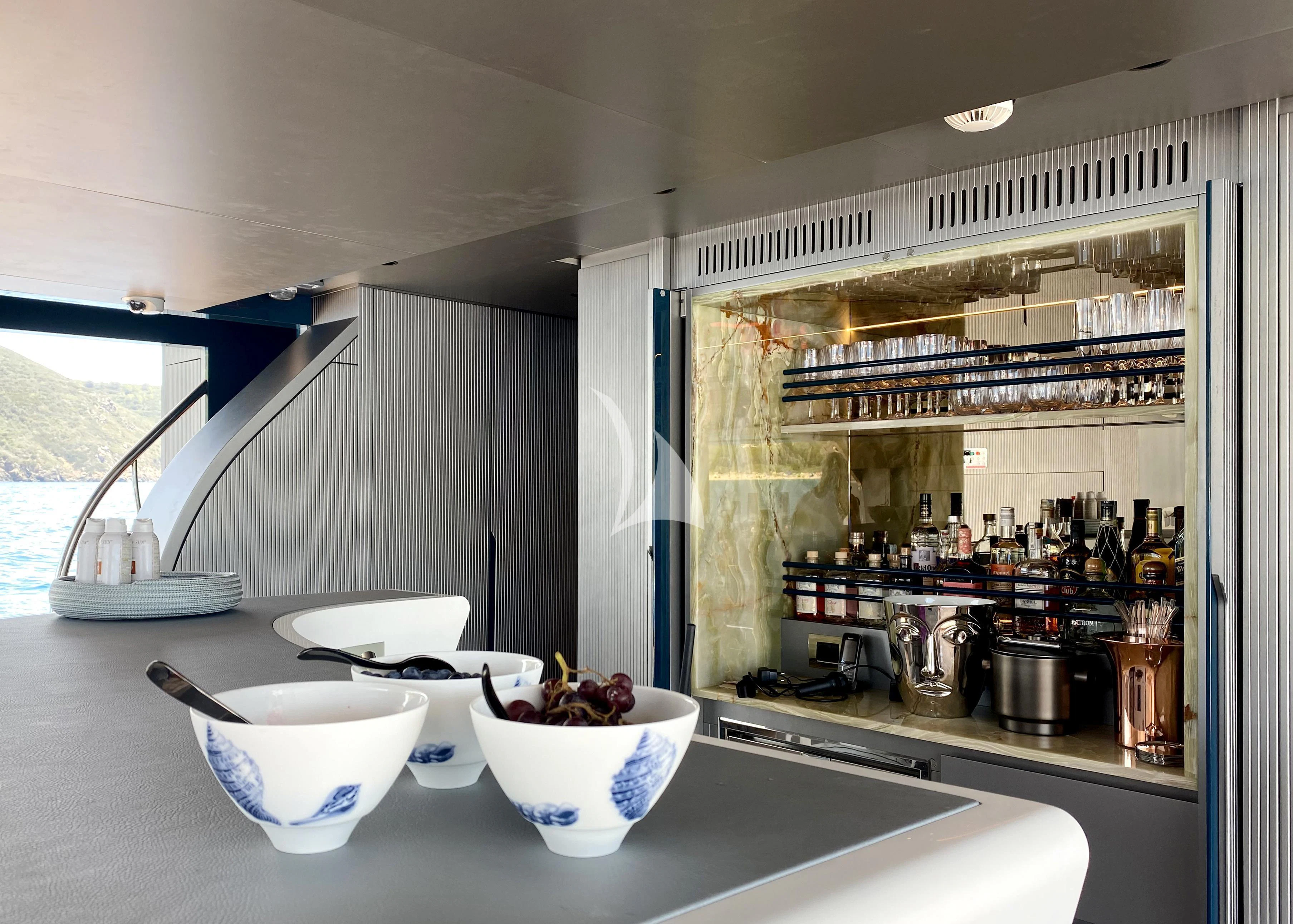 a kitchen with a couple bowls of fruit on a counter aboard PANDION PEARL Yacht for Charter