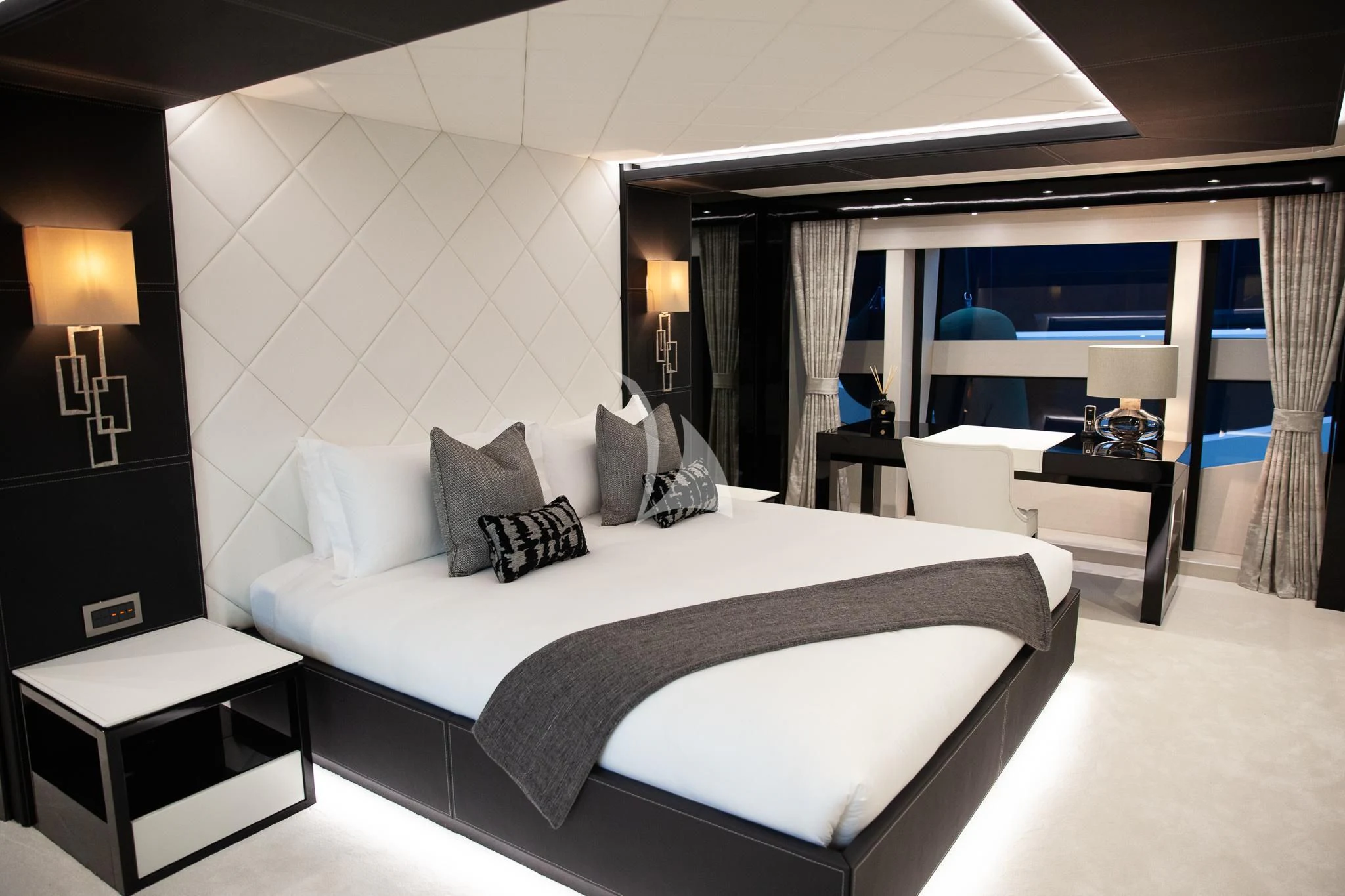 a large bed in a hotel room aboard SONISHI Yacht for Sale