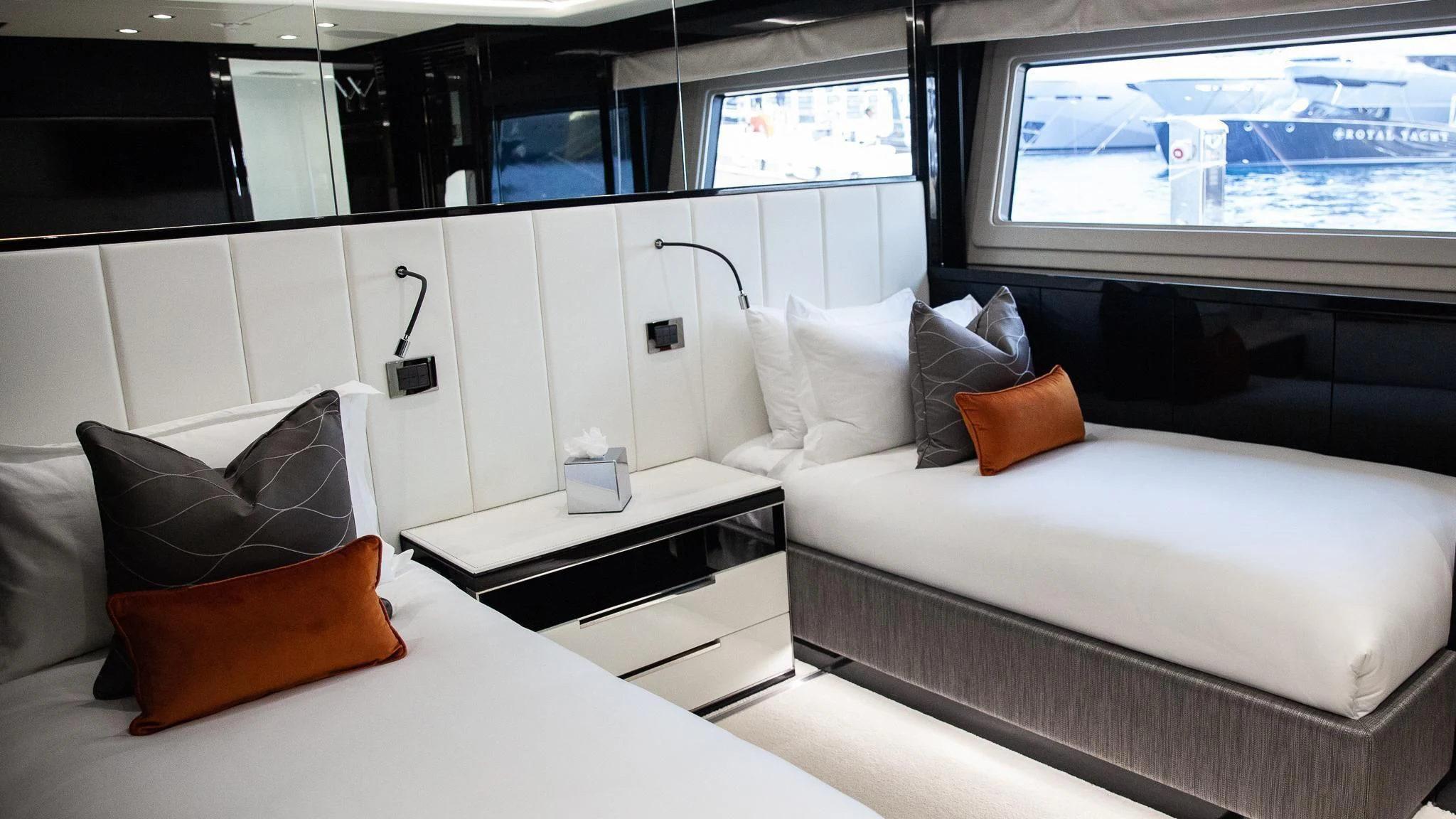 a room with white beds aboard SONISHI Yacht for Sale