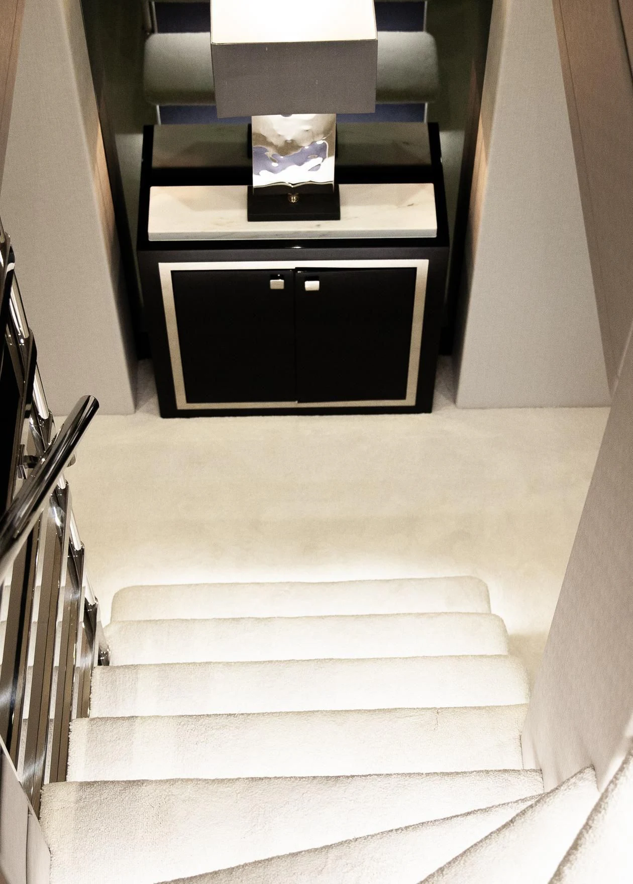 a staircase with a tv on the side aboard SONISHI Yacht for Sale